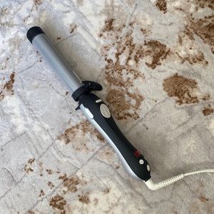 Beachwaver curling iron about two years old. Works great!